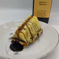 Broiled pineapple drizzled with Olio's raspberry balsamic vinegar.