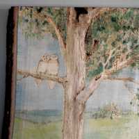 The Library is decorated with a woodland theme including this watercolor wood-burning.