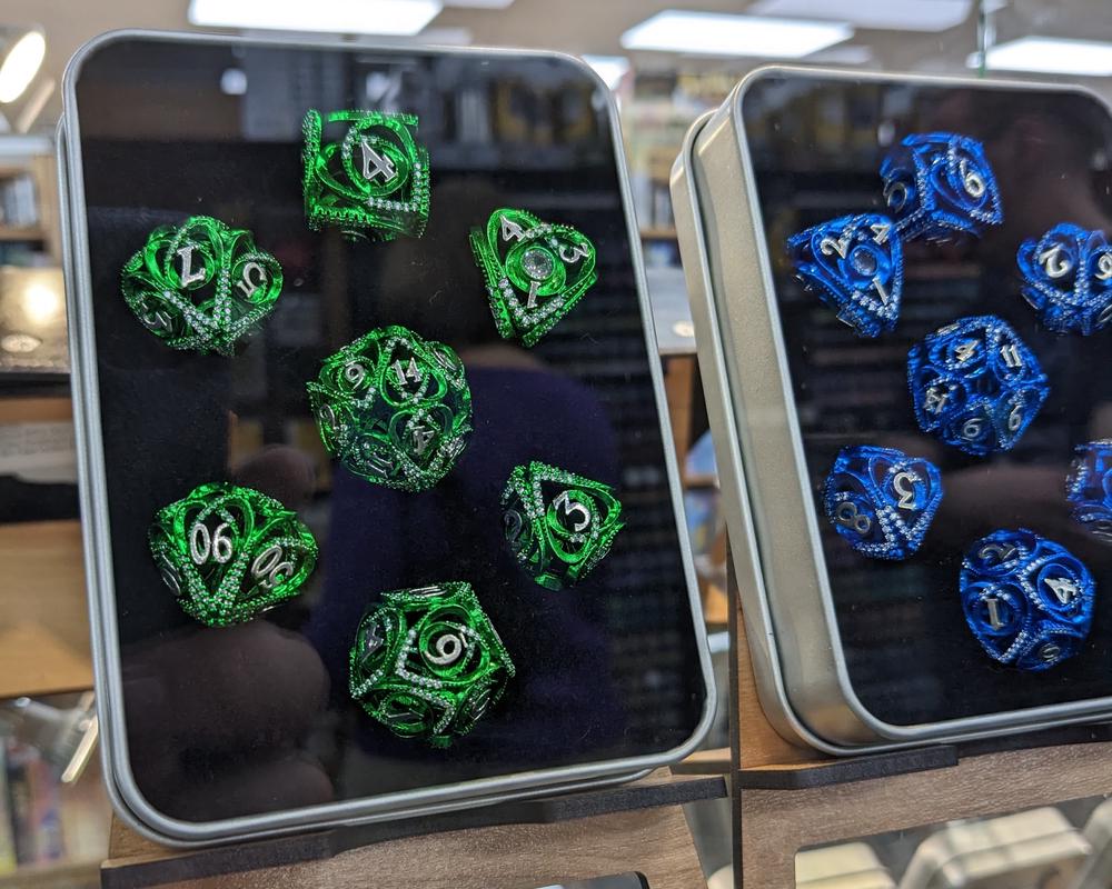 Six Feet Under has good selection of dice, miniatures, and paints.