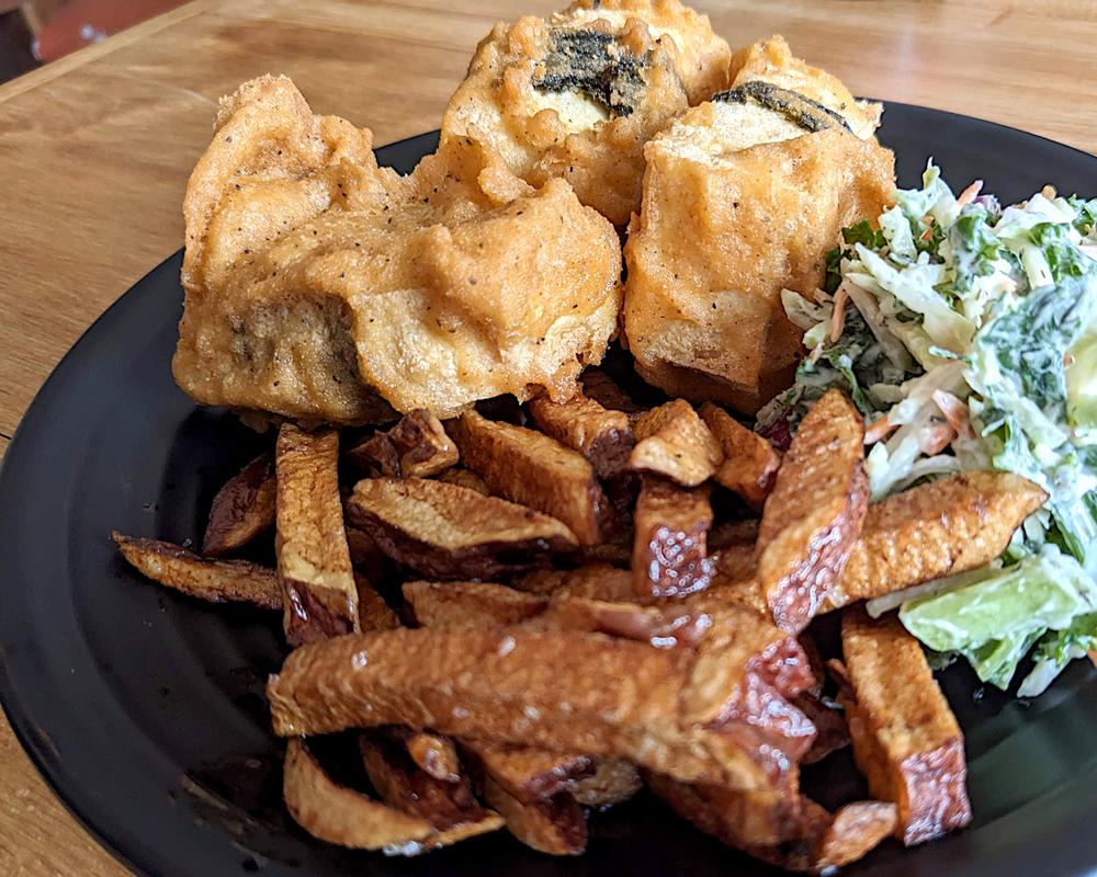 Fish and Chips made from blocks of battered and fried tofu, served with slaw.