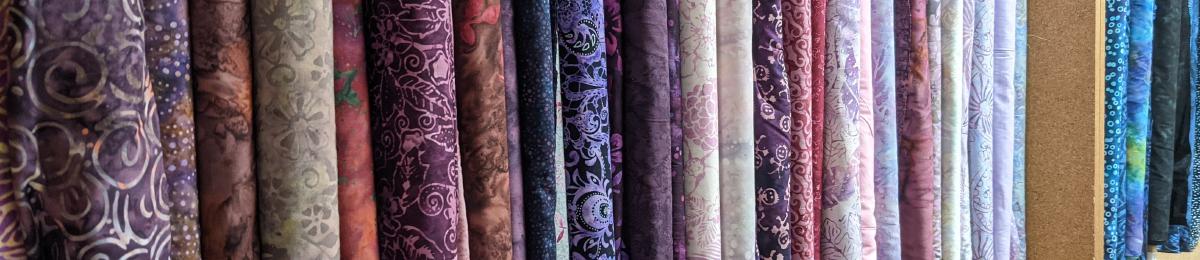 Bolts of fabrics for sale at Cedar Lane Dry Goods.